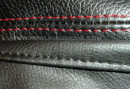 Red stitching on a shift boot